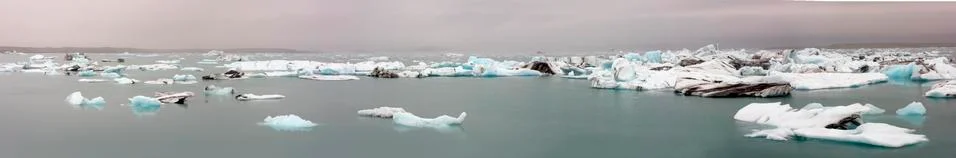 Cracking ice floating on lake Stock Photos