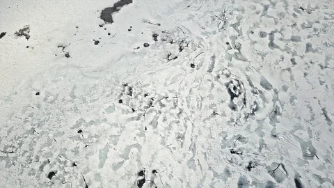 Cracking patterns of melting mountain lake in Norway Stock Footage 98387274
