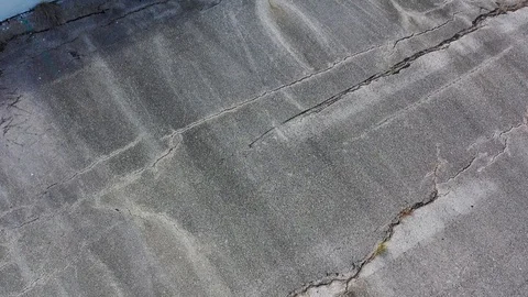 Cracking pavement and empty racetrack press box, College Station, Texas, USA Stock Footage 129209764