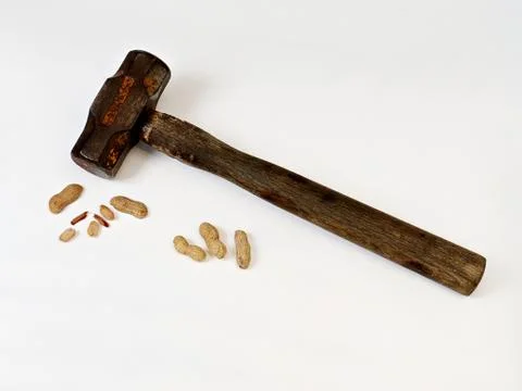 Cracking Peanuts with a Sledge Hammer Stock Photos