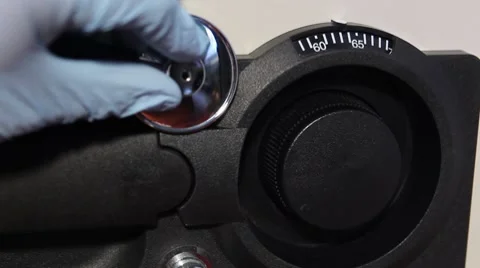 Cracking a Safe Revealing a Green-screen Chroma-key background Stock Footage 8773350