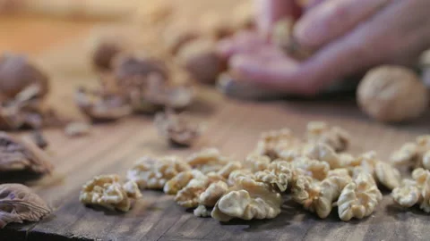 Cracking walnut with nutcracker Stock Footage 223677983