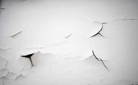 Cracking white paint on a wall Stock Photos