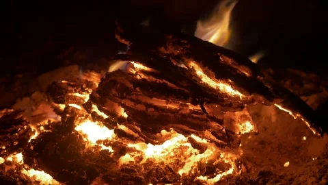 Crackling fire collapses into warm embers Stock Footage 308471845