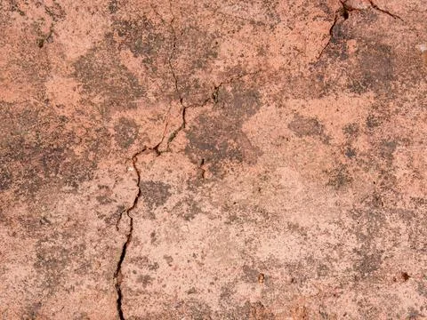 Cracks and marks on rustic clay floor tiles Фото
