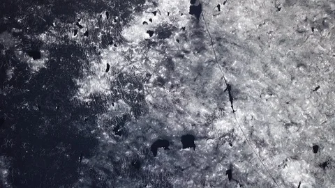 Cracks and patterns on melting ice cover at lake in springtime Stock Footage 116175720