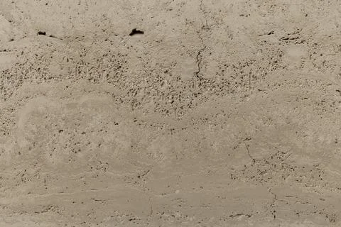 Cracks and textures can be seen on the surface of dry earth in an outdoor are Stock Photos