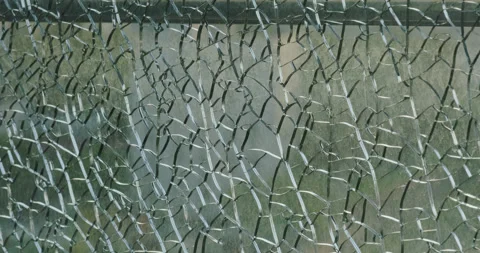 Cracks in the broken glass like a spider's web Stock Footage 237057012