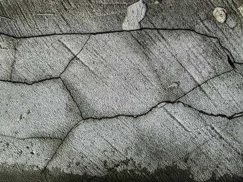 Cracks in the concrete wall. Old destroyed cement surface. Grain texture with Stock Illustration
