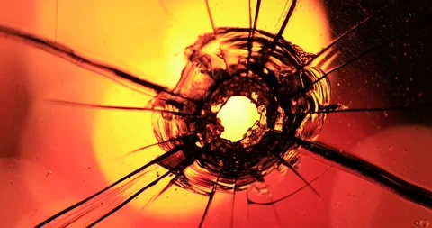 Cracks in the glass on the background of fire Stock Footage 220740097