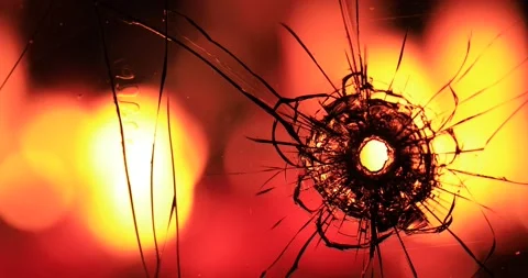 Cracks in the glass on the background of fire Stock Footage 220740146