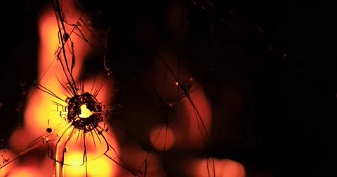 Cracks in the glass on the background of fire Stock Footage 220740213