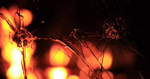 Cracks in the glass on the background of fire Stock Footage 220740266