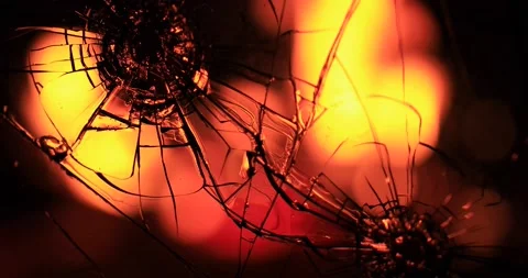 Cracks in the glass on the background of fire Stock Footage 220740354