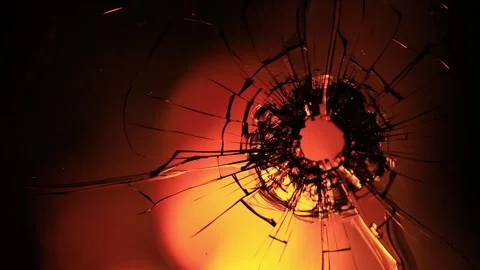 Cracks in the glass on the background of fire Stock Footage 220740713