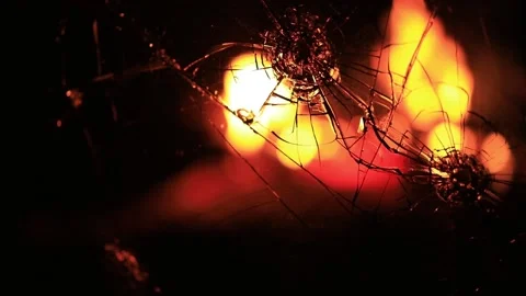 Cracks in the glass on the background of fire Stock Footage 220740726