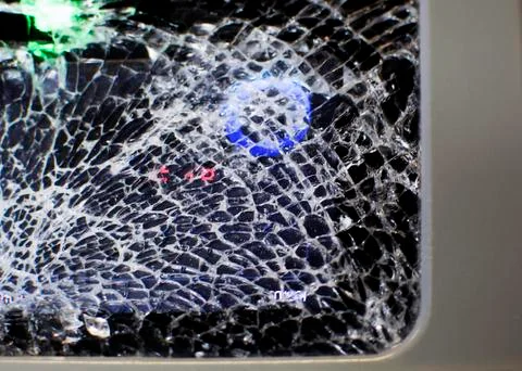 Cracks on the glass working validator Stock Photos