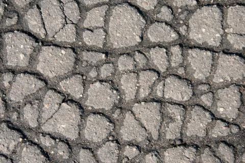 Cracks on gray pavement Stock Photos
