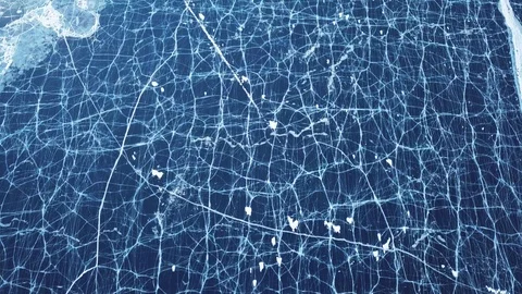 Cracks in ice from aerial view. Winter in Siberia, Baikal Lake. Stock Footage 105507400