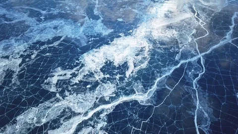 Cracks in ice from aerial view. Winter in Siberia, Baikal Lake. Stock Footage 105507413