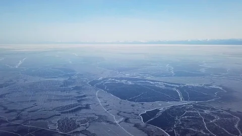 Cracks in ice from aerial view. Winter in Siberia, Baikal Lake. Stock Footage 105507814