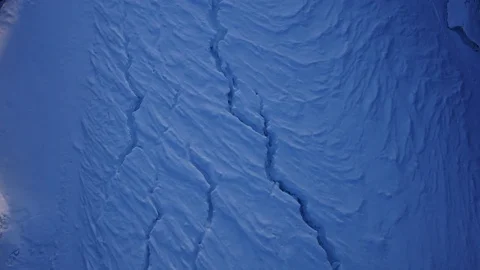 Cracks in the ice mountain river in the Altai winter Stock Footage 72634776