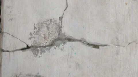 Cracks that occur in the wall due to weak plastering Stock Footage 336577773