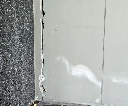 Cracks or collapse of building columns are caused by earthquakes. Stock Photos