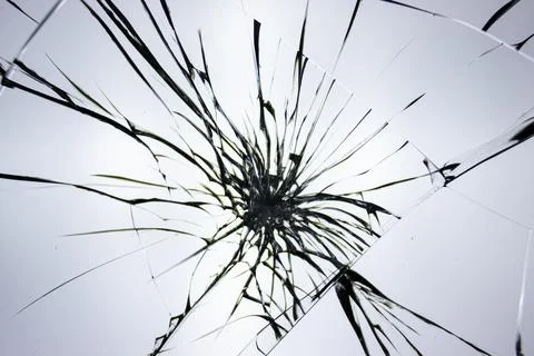 Cracks pattern on broken glass, abstraction of chips and lines from impact on Stock Photos