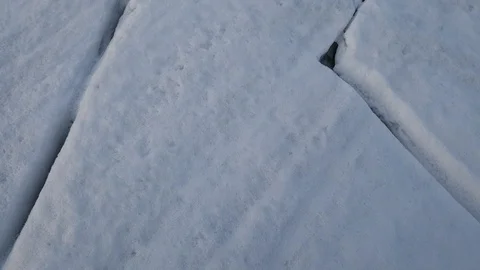 The Cracks in the snow cover. Snow cracks close up. Stock Footage 105106929