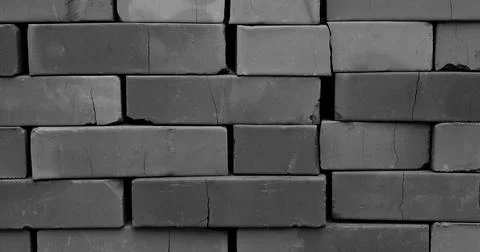 Cracks on stacked bricks black and white photo Stock Photos