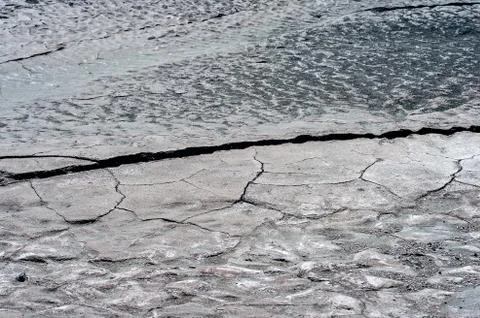 Cracks on the surface of dry land Stock Photos