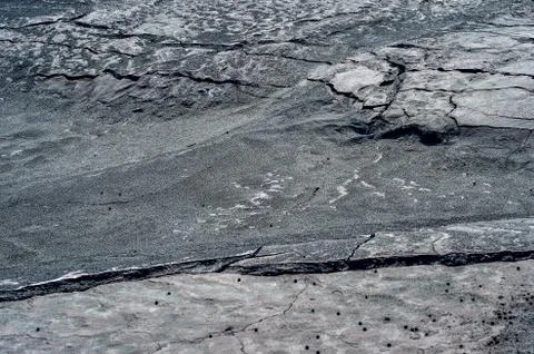 Cracks on the surface of dry land Stock Photos