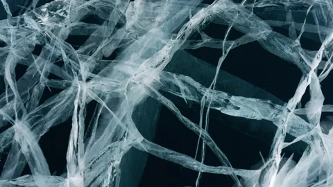 Cracks of transparent blue ice of Baikal lake, dolly motion, close up view Stock Footage 185049697