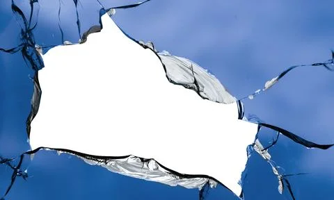Cracks in the window glass on a background of sky. Foto stock