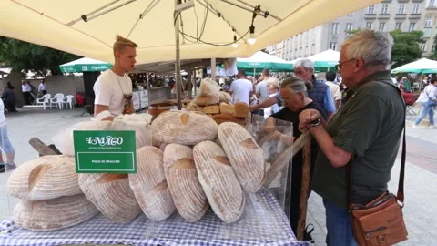 Cracow, Poland. Bread stall at Folk Art and Craft Fair on the Main Market Place. Stock Footage 159234959