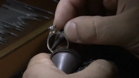 Crafstman making diamond solitaire ring. hand made diamond solitaire rings. Stock Footage 139638882