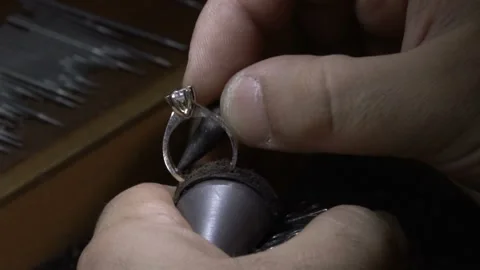 Crafstman making diamond solitaire ring. hand made diamond solitaire rings. Stock Footage 139683320