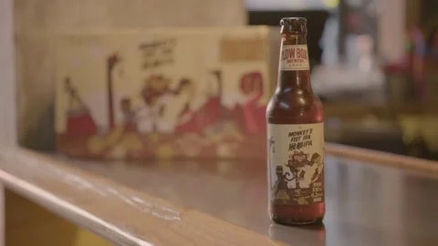 Craft Beer Bottle Displayed on Bar Counter in Beijing Food and Drink Scene Stock Footage 345759220