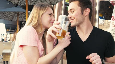 Craft beer drinking young couple having fun at cafe Video stock 49332072