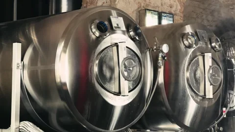 Craft beer fermentation tanks at the manufacturing facility. Stock Footage 323442910