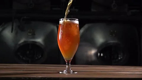 Craft Beer Pours Into Glass Captured at 1000 Fps Showcasing Bubbles and Foam in Stock Footage 324832020