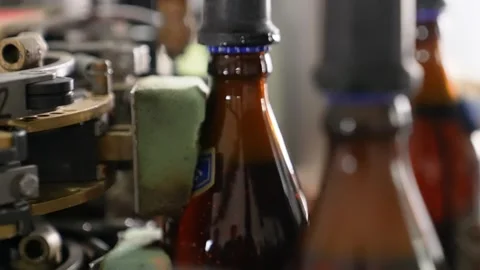 Craft beer production. Conveyor with empty bottles. Stock Footage 256181496