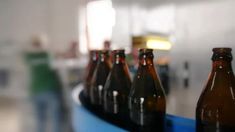 Craft beer production. Conveyor with empty bottles. Stock Footage 256181503