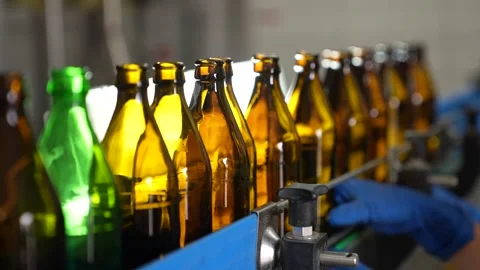 Craft beer production. Conveyor with empty bottles. Stock Footage 256181716