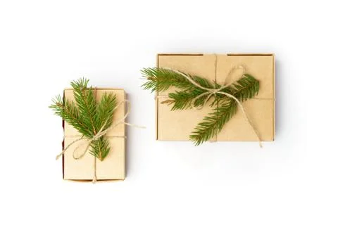 Craft boxes with pine tree branches and natural rope isolated on white Stock Photos