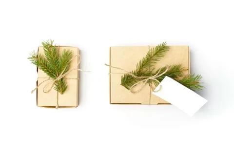 Craft boxes with pine tree branches, natural rope and label isolated on white Stock Photos