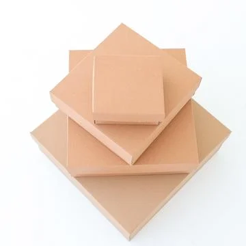 Craft boxes on a white background are stacked on top of each other. Place f.. Stock Photos