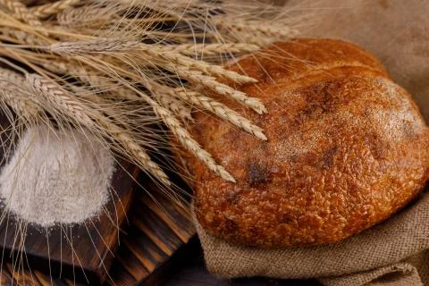 Craft bread in the hands of a man close-up. The concept of healthy food and t Stock Photos
