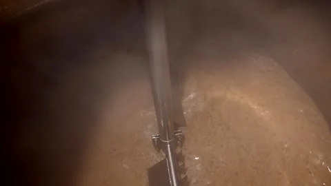 Craft Brewery Brewing Process in Slow Motion Featuring Hops, Malt, and Stock Footage 323917493